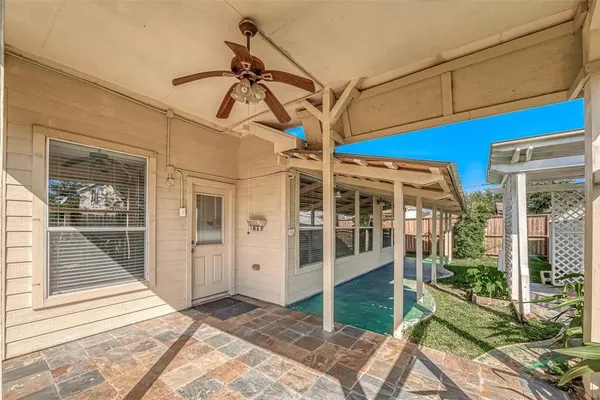 a view of a chair and tables the patio