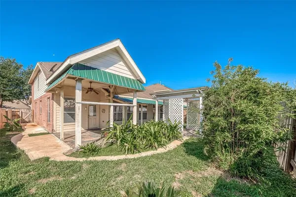 a backyard of a house with lots of green space