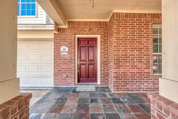 a view of a brick house with a door