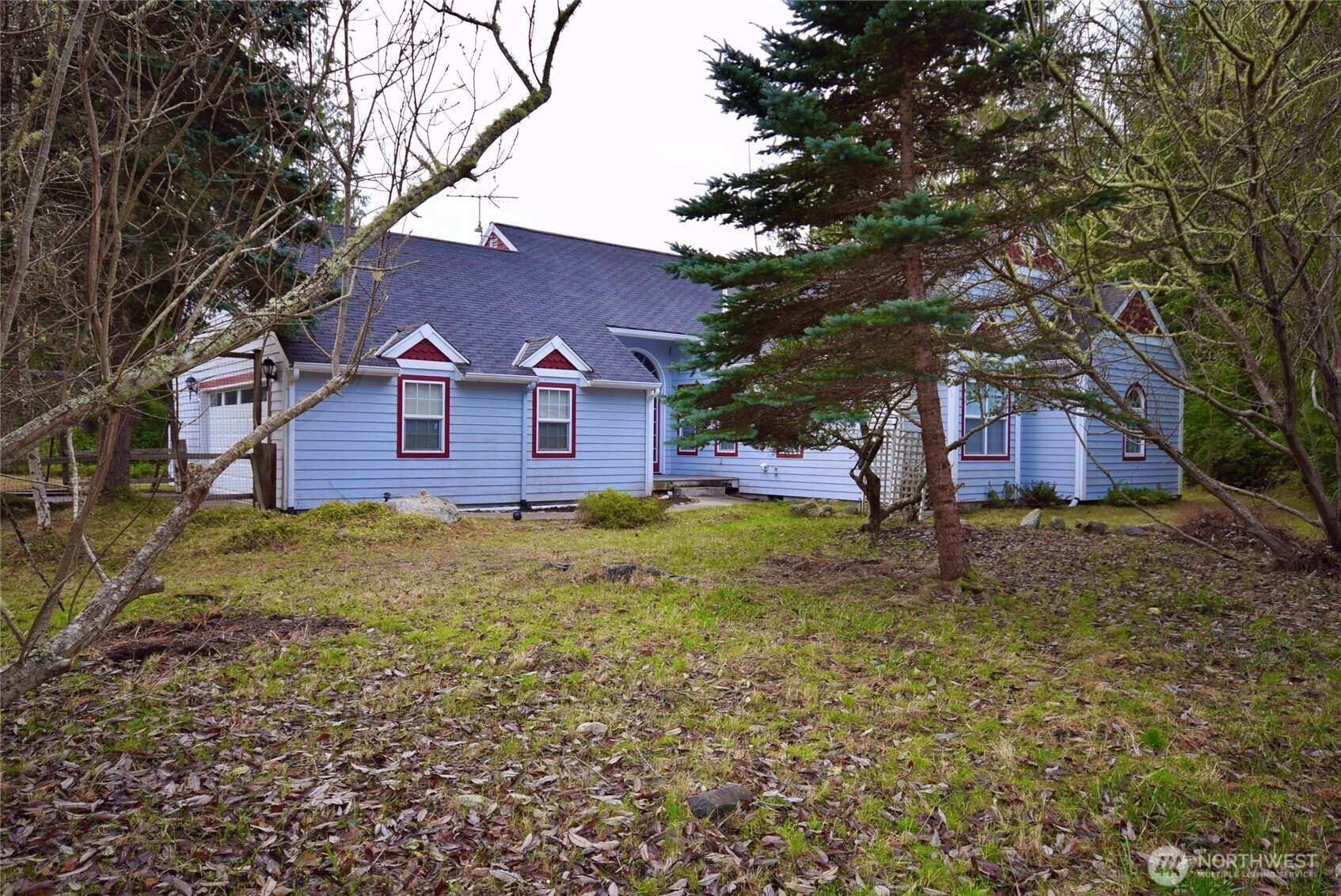 323 Critter Country Trail Sequim, WA 98382 - Photo 3 of 37 a front view of a house with a yard