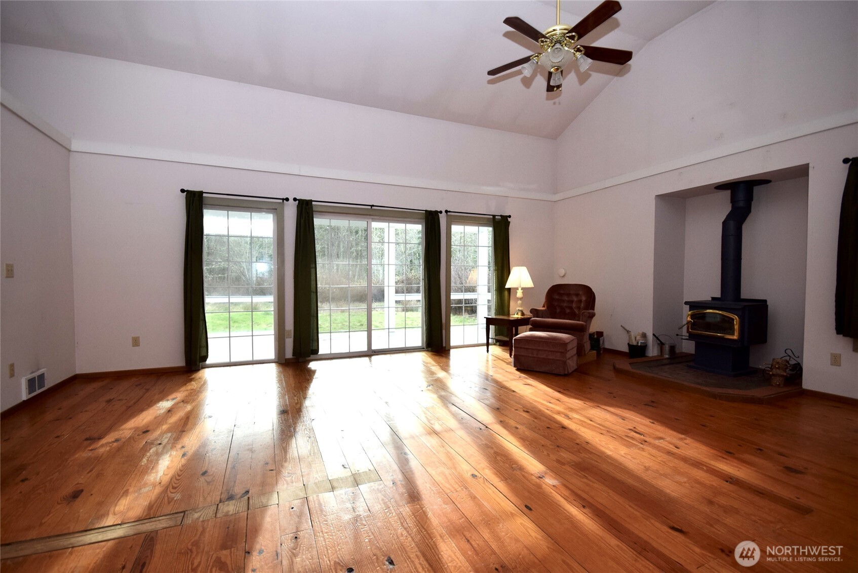 323 Critter Country Trail Sequim, WA 98382 - Photo 8 of 37 a spacious bedroom with a bed and a large window