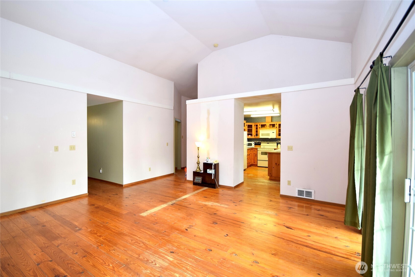 323 Critter Country Trail Sequim, WA 98382 - Photo 9 of 37 a view of an empty room with wooden floor and a window