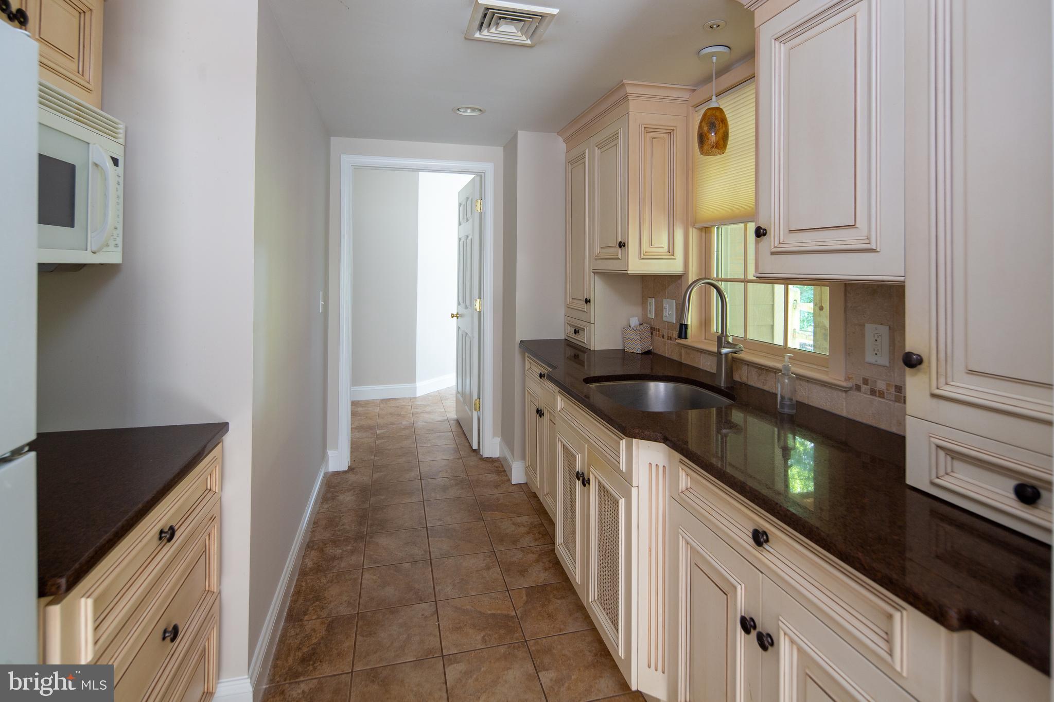 5708 Ridgeview Drive Doylestown, PA 18902 - Photo 28 of 37 Lower Level 2nd Kitchen, granite counter w/tile
