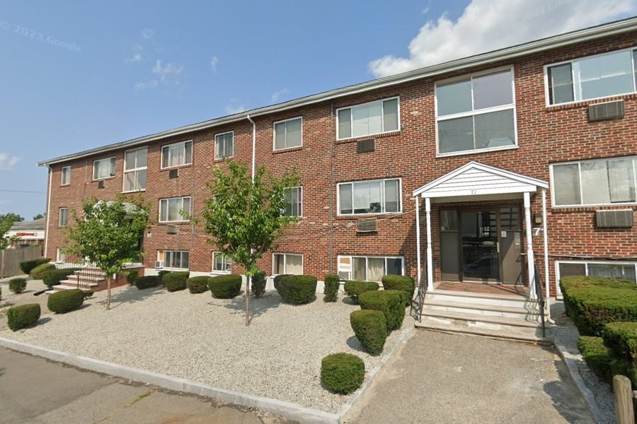 71 Pond Street, Unit 21A Quincy, MA 02169 - Photo 1 of 9 a front view of a house with a garden