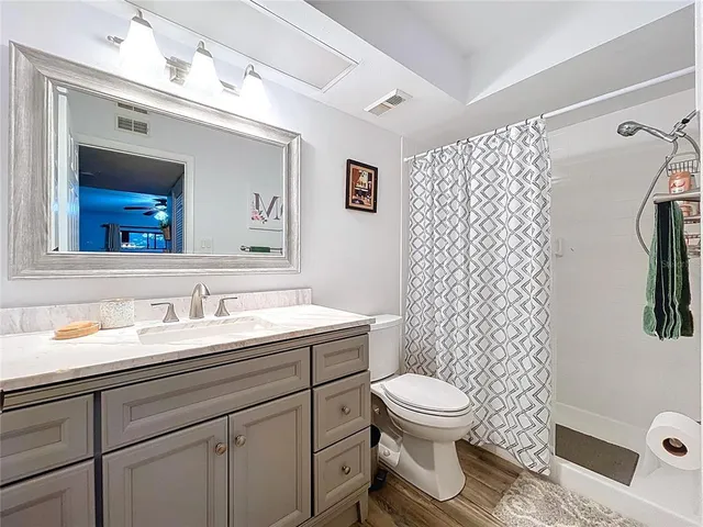 a utility room with a sink and a mirror