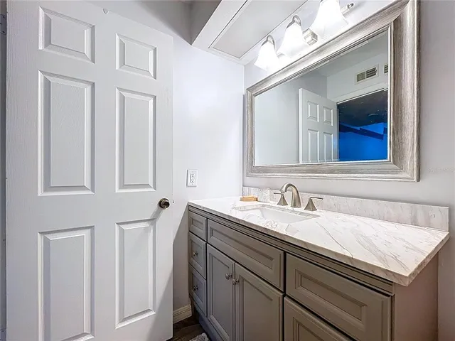 a bedroom with a bed and balcony view