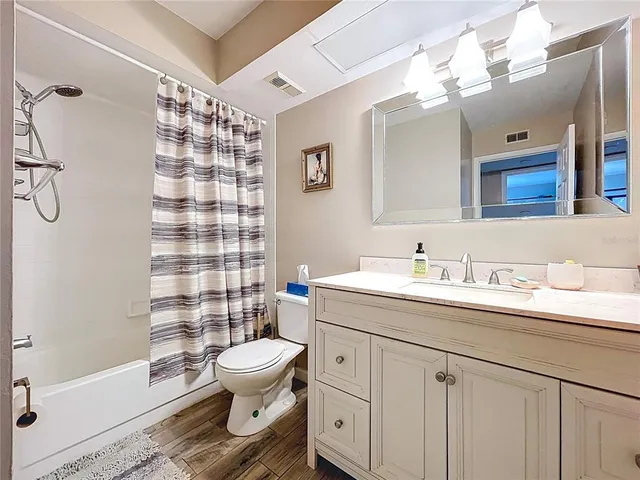 a bathroom with a sink a vanity and a mirror