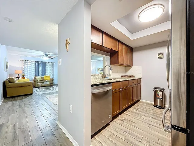 a view of a kitchen with furniture and window