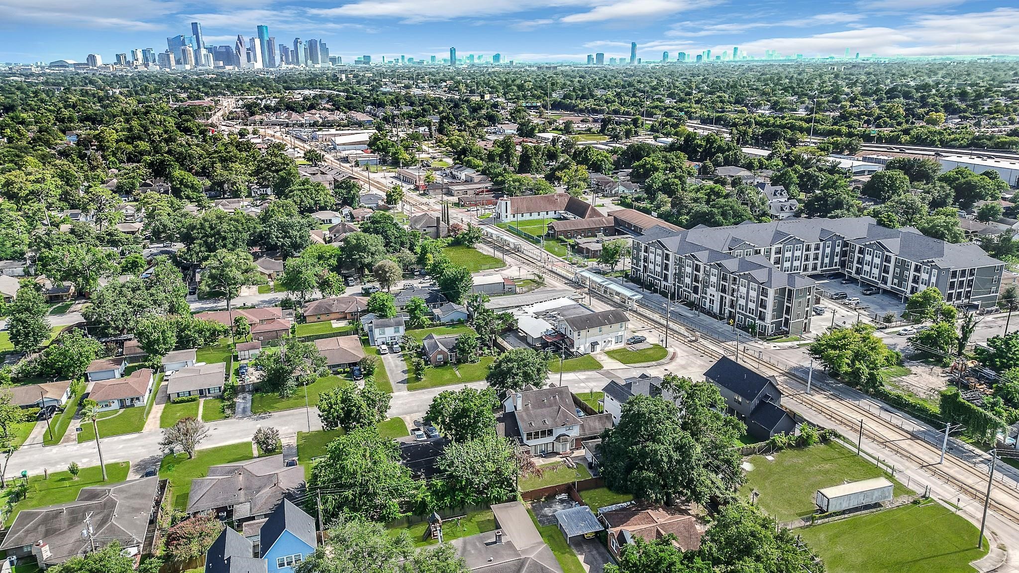 an aerial view of residential houses with outdoor space