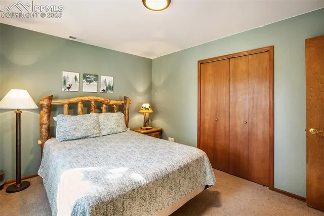 a bedroom with a bed and a table