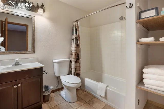 a white toilet sitting next to a bathroom sink