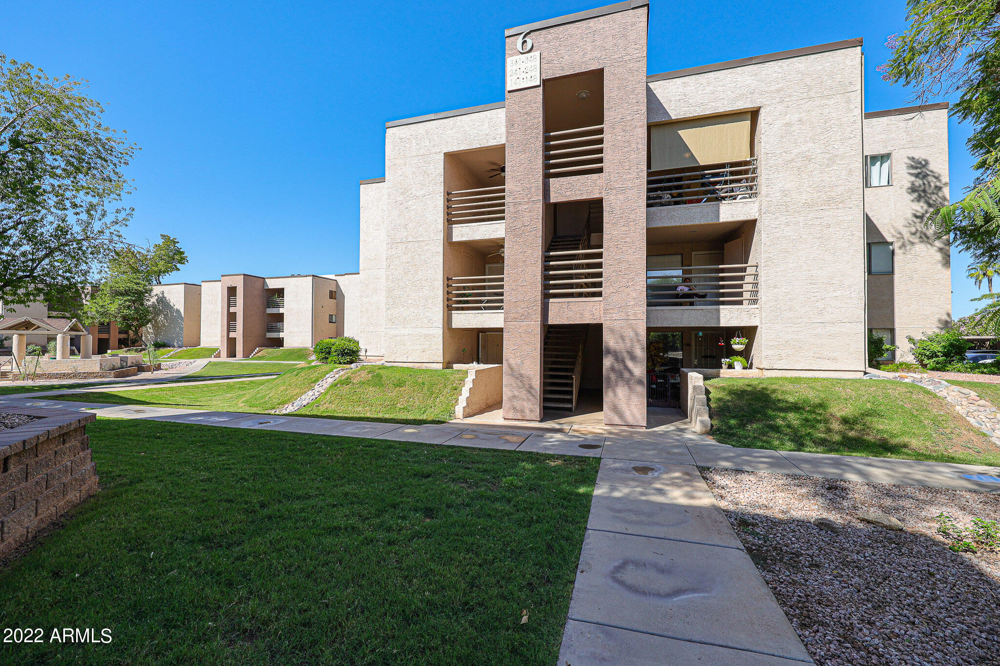 1340 North Recker Road, Unit 141 Mesa, AZ 85205 - Photo 1 of 17 a view of a house with a yard
