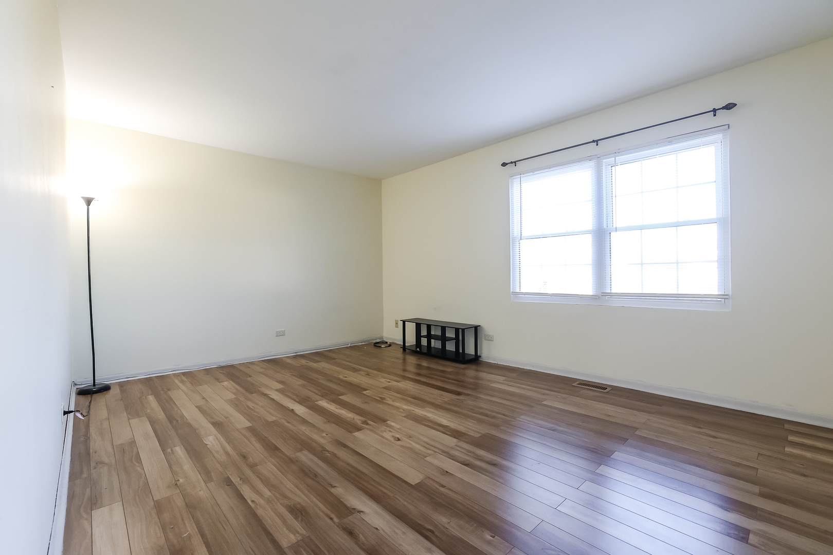 347 Juniper Circle Streamwood, IL 60107 - Photo 13 of 23 a view of an empty room with wooden floor and a window