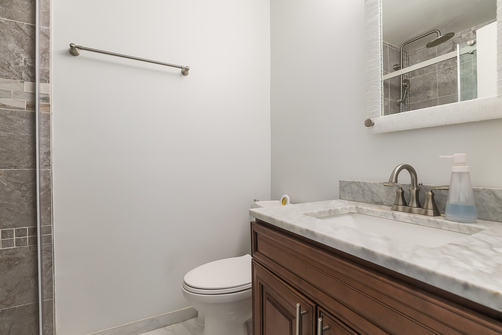 347 Juniper Circle Streamwood, IL 60107 - Photo 16 of 23 a bathroom with a granite countertop sink toilet and mirror