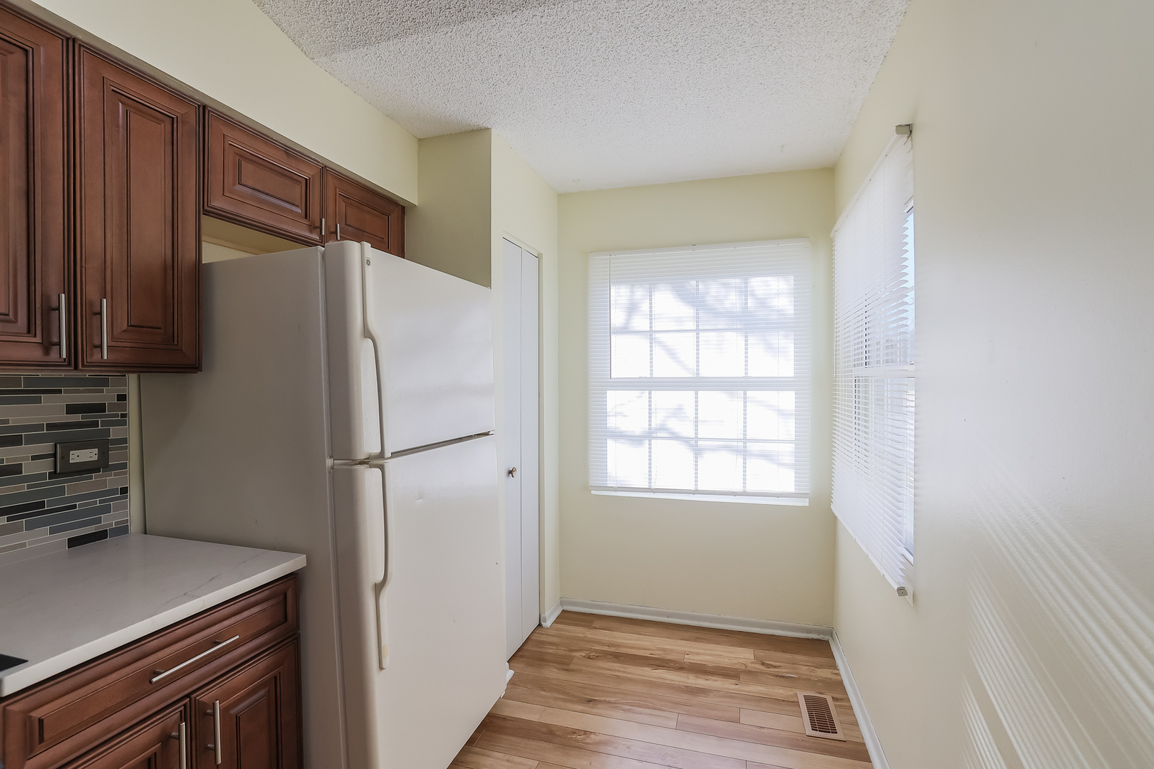 347 Juniper Circle Streamwood, IL 60107 - Photo 5 of 23 a white refrigerator freezer and a stove sitting inside of a kitchen
