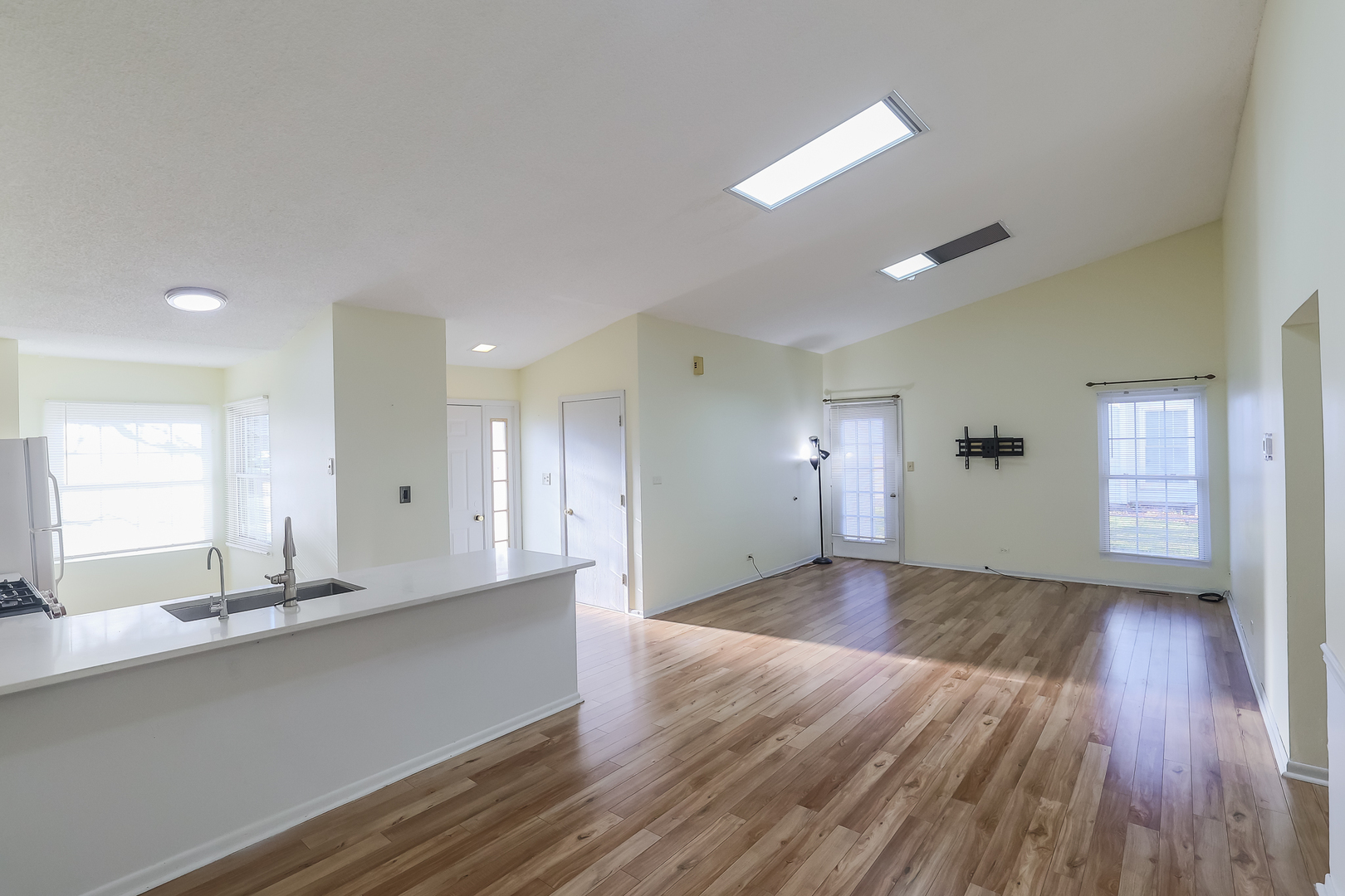 347 Juniper Circle Streamwood, IL 60107 - Photo 6 of 23 a view of a kitchen with wooden floor and a sink