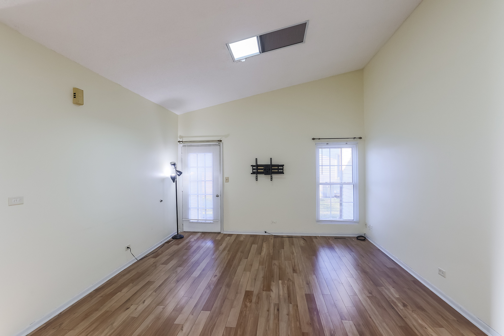 347 Juniper Circle Streamwood, IL 60107 - Photo 7 of 23 wooden floor in an empty room with a window