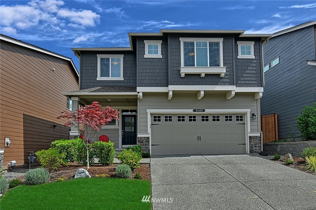 20322 85th Place Northeast Bothell, WA 98011 - Photo 1 of 24 a view of a building with a garden