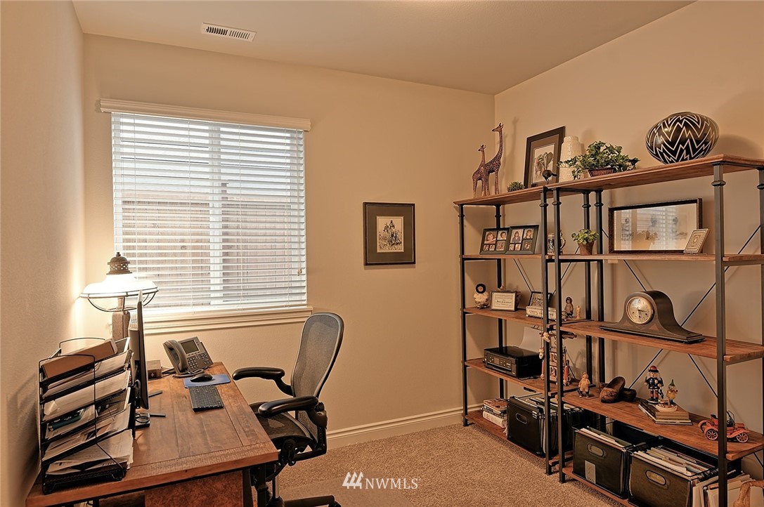 20322 85th Place Northeast Bothell, WA 98011 - Photo 11 of 24 a view of a workspace with furniture and a window