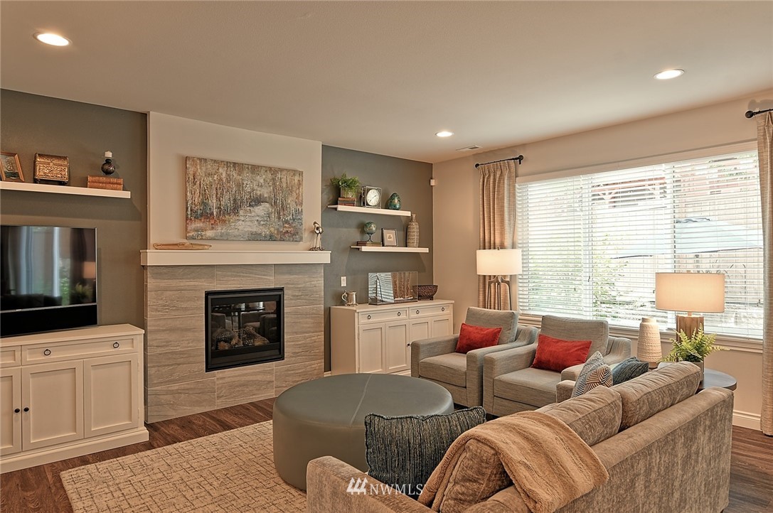 20322 85th Place Northeast Bothell, WA 98011 - Photo 12 of 24 a living room with furniture and a fireplace
