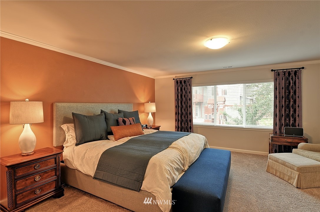20322 85th Place Northeast Bothell, WA 98011 - Photo 15 of 24 a bed sitting in a bedroom next to a window