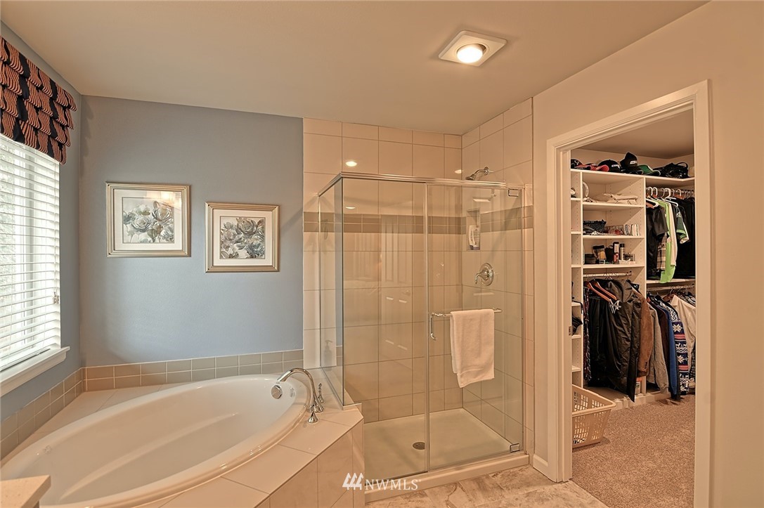 20322 85th Place Northeast Bothell, WA 98011 - Photo 16 of 24 a bathroom with a bathtub and a shower