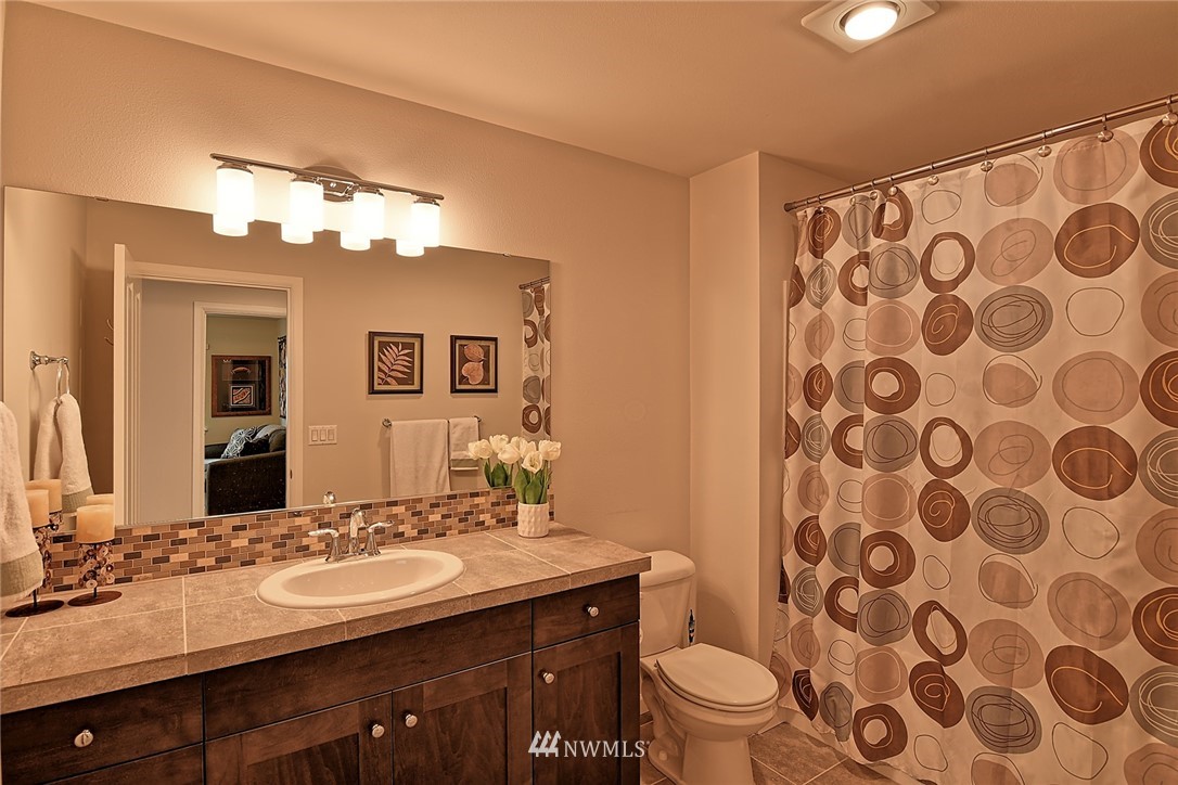 20322 85th Place Northeast Bothell, WA 98011 - Photo 20 of 24 a bathroom with a sink and a mirror
