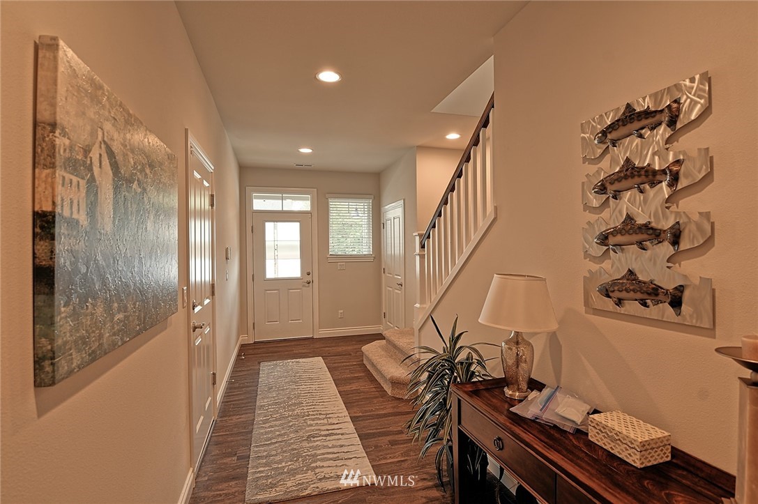 20322 85th Place Northeast Bothell, WA 98011 - Photo 8 of 24 a very nice looking room with wooden floor and stairs