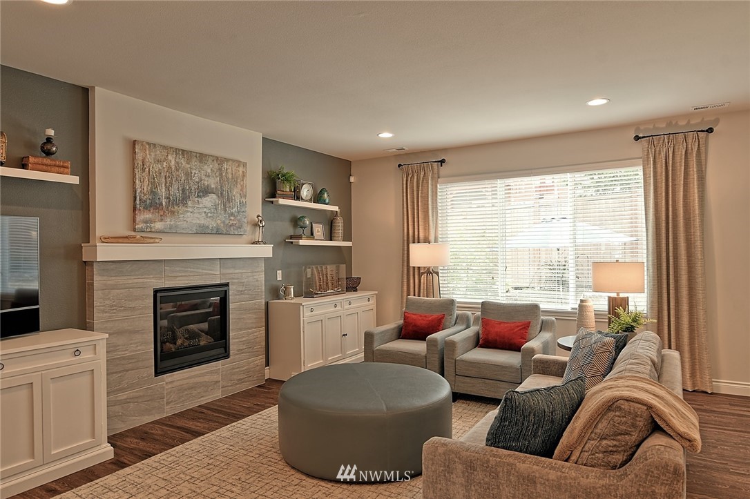 20322 85th Place Northeast Bothell, WA 98011 - Photo 9 of 24 a living room with furniture and a fireplace