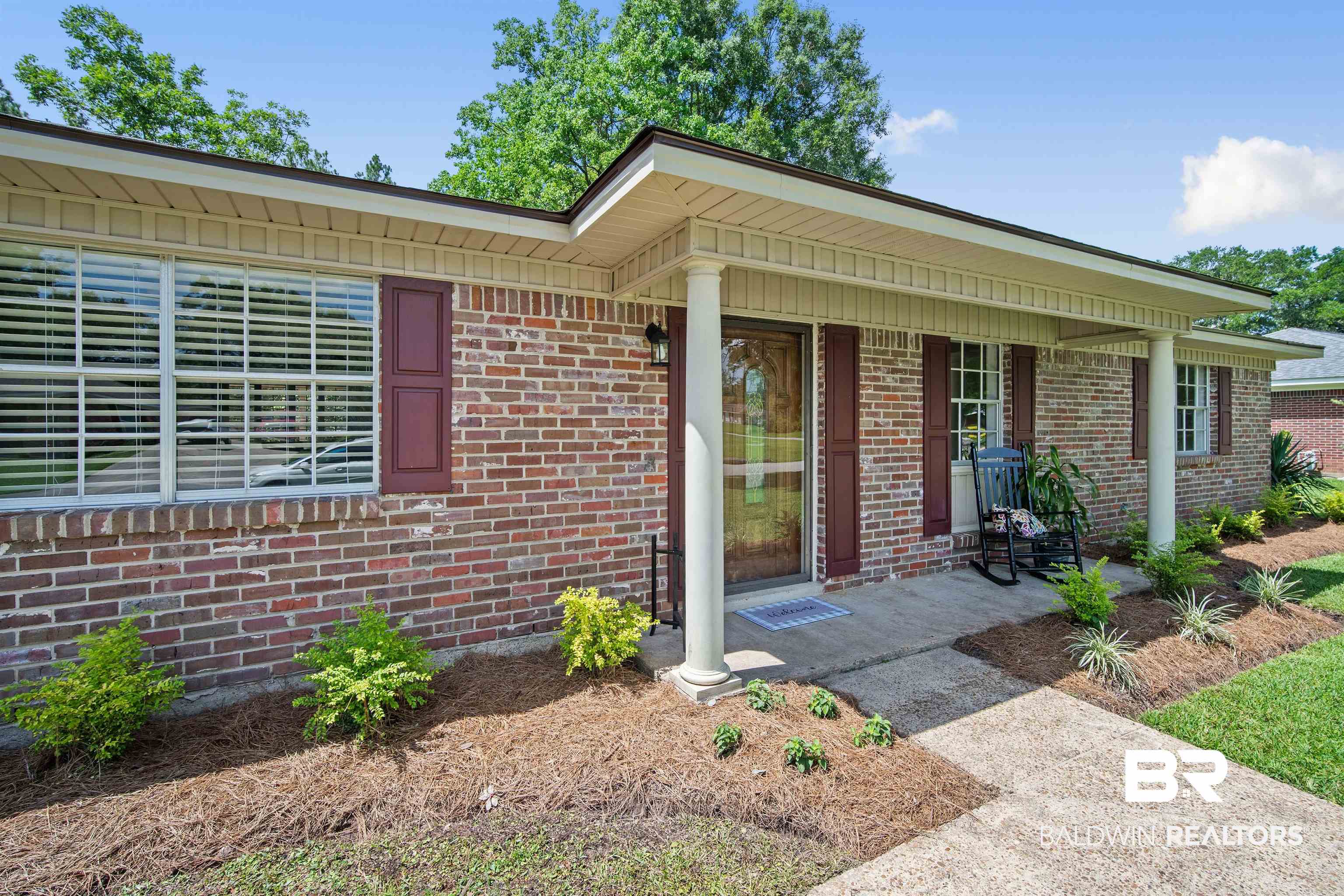1325 Pawnee Circle Saraland, AL 36571 - Photo 3 of 26 Doorway to property with brick siding