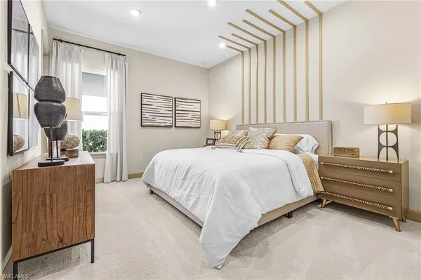 a bedroom with bed and window