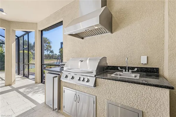 a kitchen with a stove and a sink