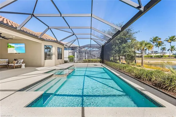 a view of a swimming pool with a patio