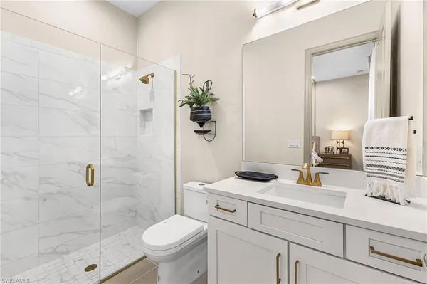 an aerial view of residential building with outdoor space and ocean view