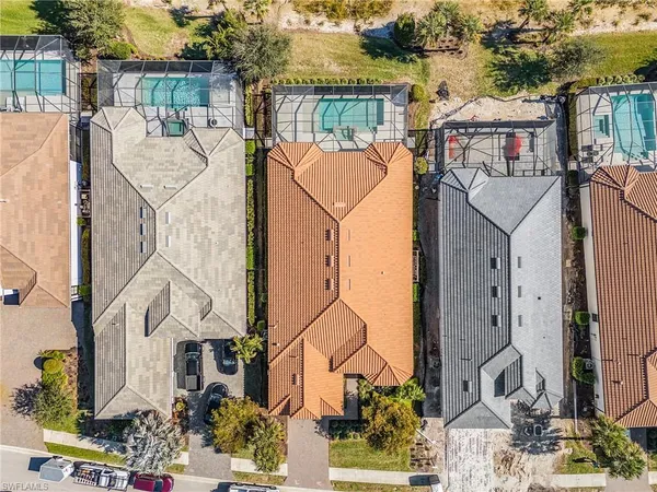an aerial view of residential building and ocean
