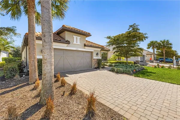 front view of a house with a yard