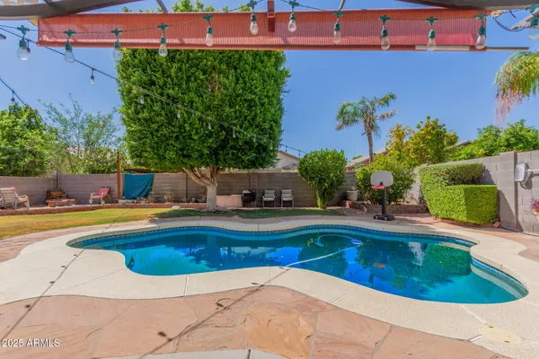 an aerial view of a house with swimming pool