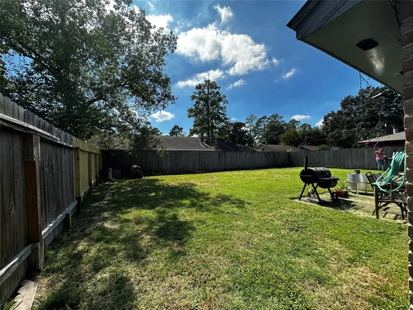 a view of backyard with seating space