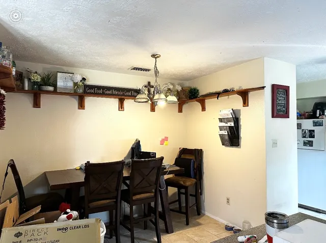 a view of a workspace with furniture