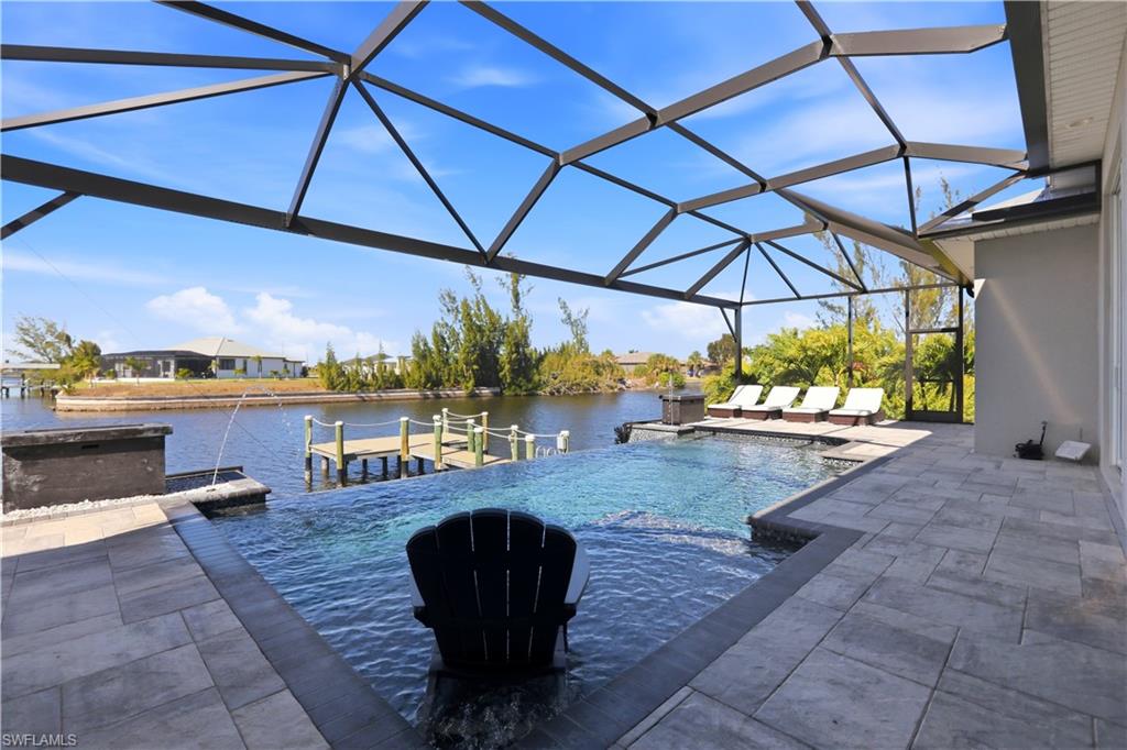 1616 Old Burnt Store Road North Cape Coral, FL 33993 - Photo 19 of 50 Swimming pool with a large lanai and views to the custom dock.