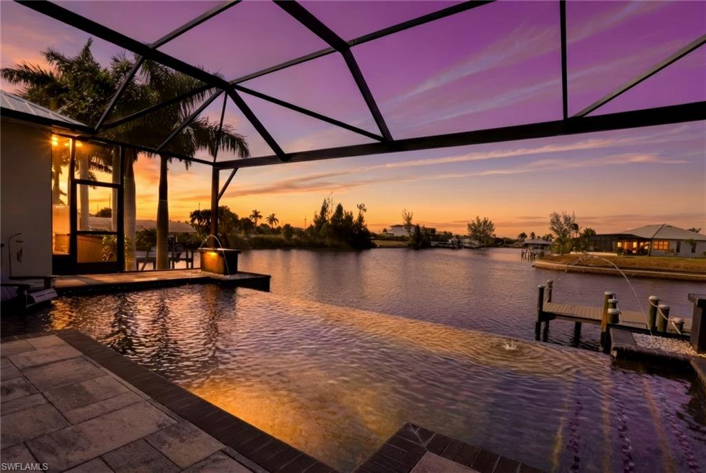 1616 Old Burnt Store Road North Cape Coral, FL 33993 - Photo 2 of 49 a view of swimming pool with outdoor seating