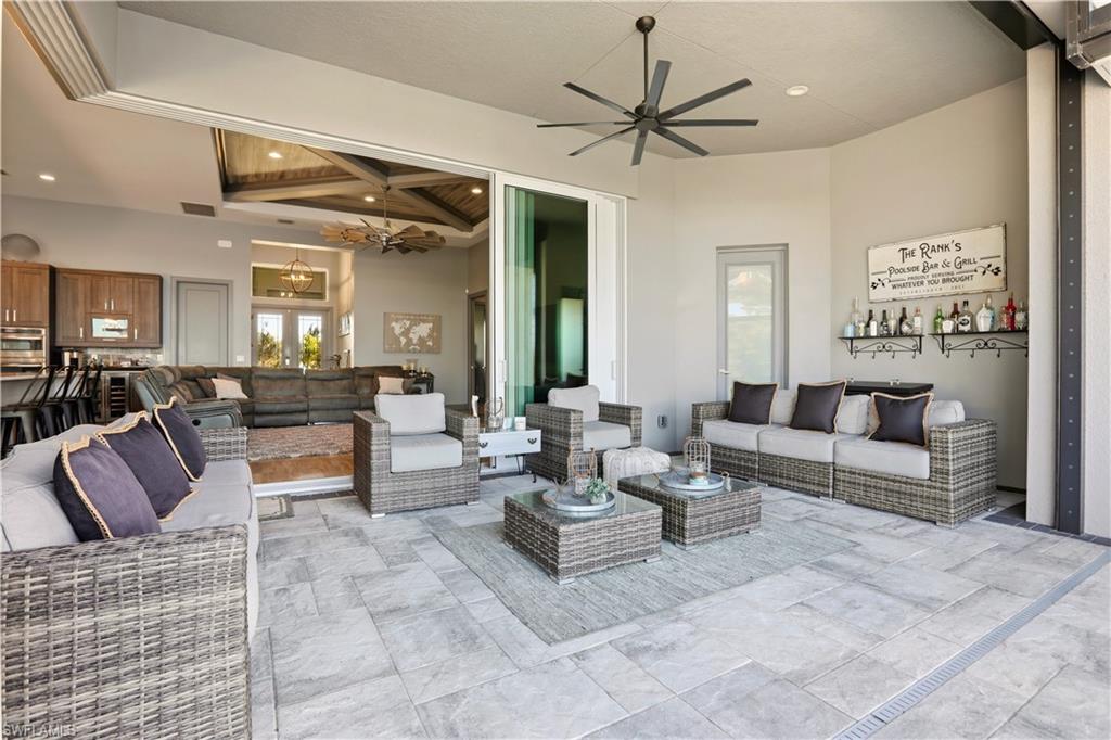 1616 Old Burnt Store Road North Cape Coral, FL 33993 - Photo 21 of 50 Enjoy the Outdoor Lifestyle out of the sun in this large covered lanai space. Large stone pavers start in the covered lanai area and extend in their entirety around the pool.