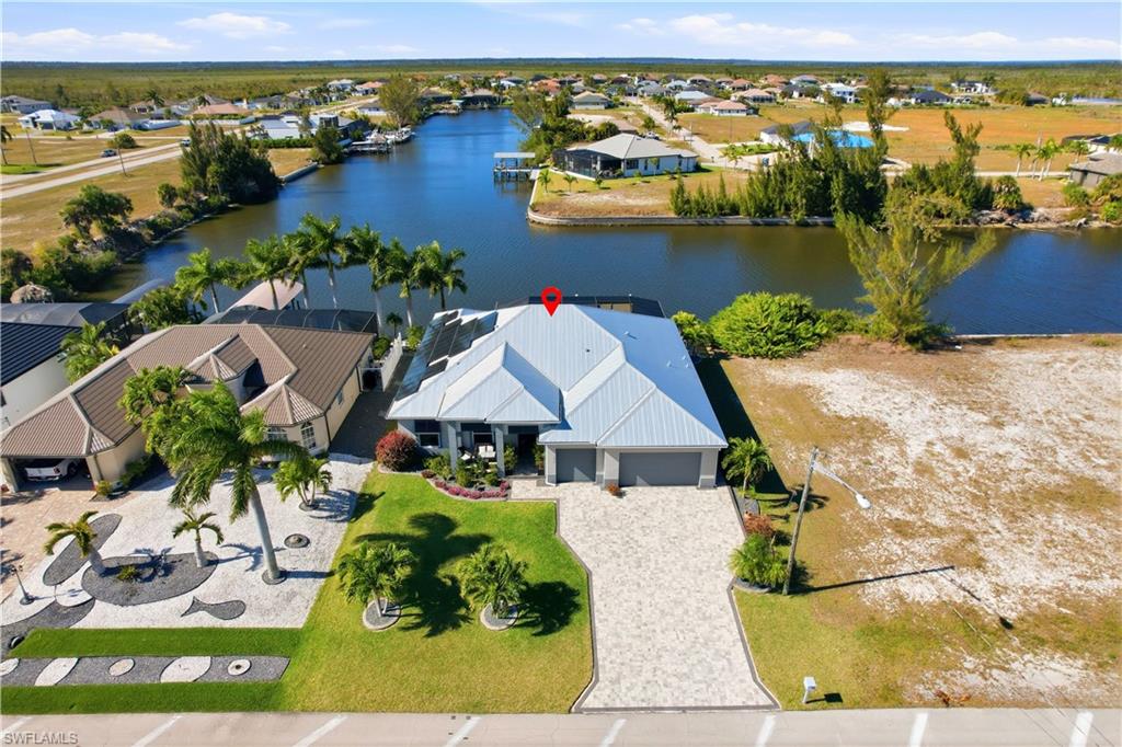 1616 Old Burnt Store Road North Cape Coral, FL 33993 - Photo 30 of 50 Aerial view of residential area with a 180' wide lot in the rear by the dock.