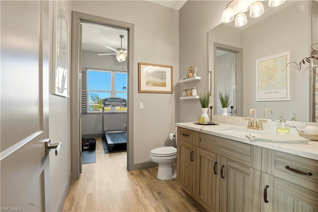 1616 Old Burnt Store Road North Cape Coral, FL 33993 - Photo 32 of 50 3rd Bathroom with vanity, light wood finished floors, and ceiling fan