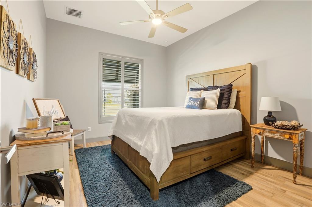 1616 Old Burnt Store Road North Cape Coral, FL 33993 - Photo 35 of 50 3rd Bedroom with light wood-style floors and a ceiling fan. Notice the plantation shutters.