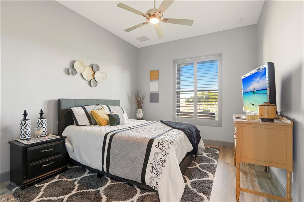 1616 Old Burnt Store Road North Cape Coral, FL 33993 - Photo 36 of 50 2nd Bedroom with light wood finished floors and ceiling fan