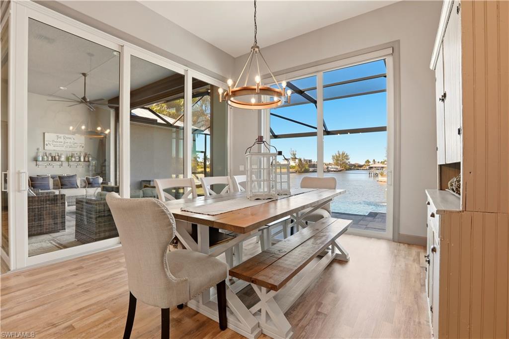 1616 Old Burnt Store Road North Cape Coral, FL 33993 - Photo 39 of 49 a dining table chairs and a chandelier