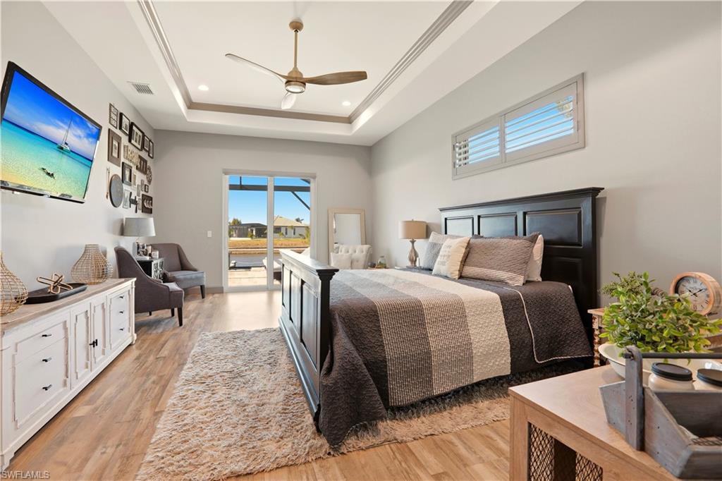 1616 Old Burnt Store Road North Cape Coral, FL 33993 - Photo 41 of 49 a bedroom with a bed and a table