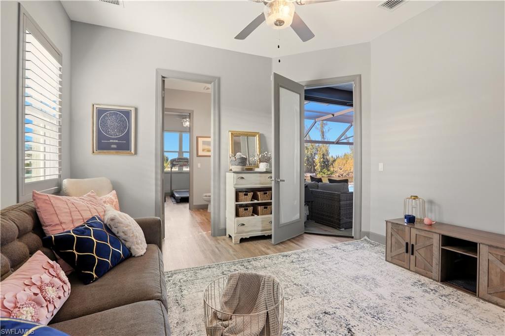 1616 Old Burnt Store Road North Cape Coral, FL 33993 - Photo 46 of 49 a living room with furniture and wooden floor