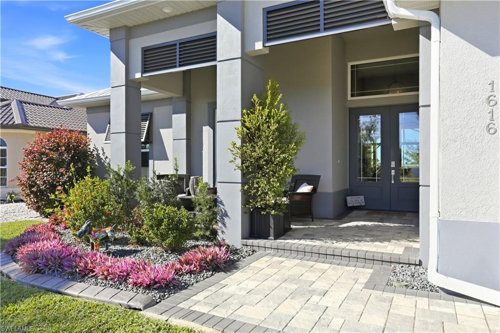 1616 Old Burnt Store Road North Cape Coral, FL 33993 - Photo 50 of 50 Entrance to property featuring french doors and stucco siding